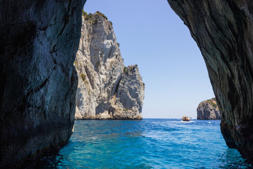 From Naples: Capri Boat Day Trip with Drinks - Onboard food and drinks: limoncello tasting and the party-like vibe