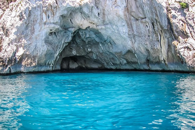 From Naples: Full-Day Capri Island and Blue Grotto Tour - Capri with a guide: Port views, upscale streets, and how the 4 hours play out