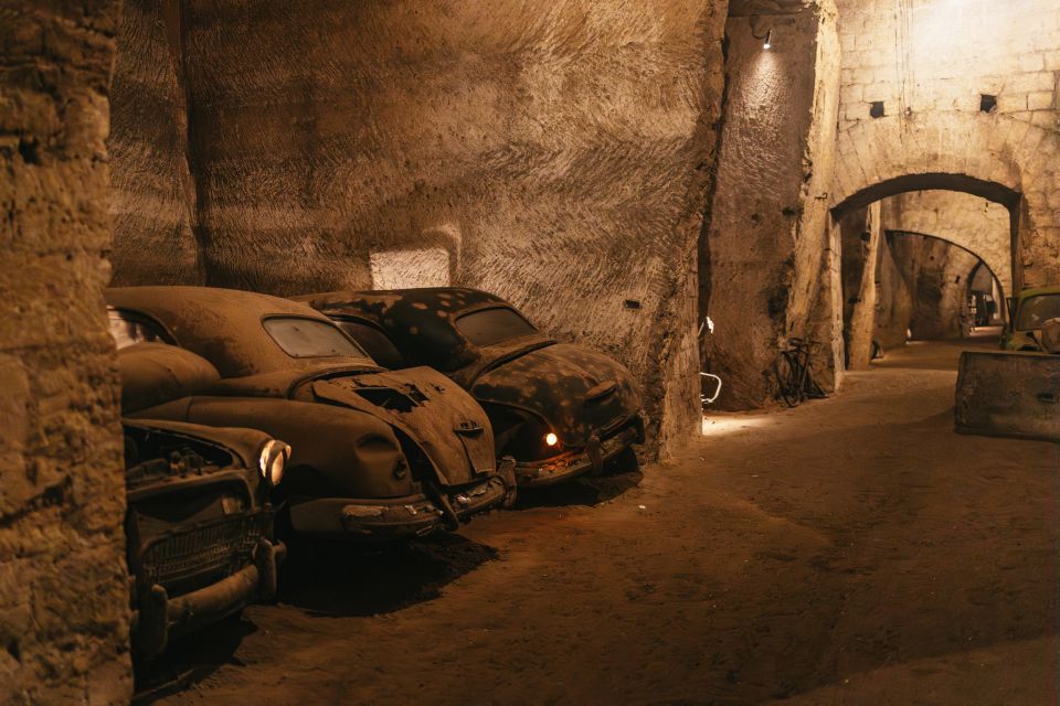 Naples: The Bourbon Tunnel Guided Tour with Entrance Ticket - The itinerary walkthrough: caves, WWII traces, and the bomb-shelter water tank